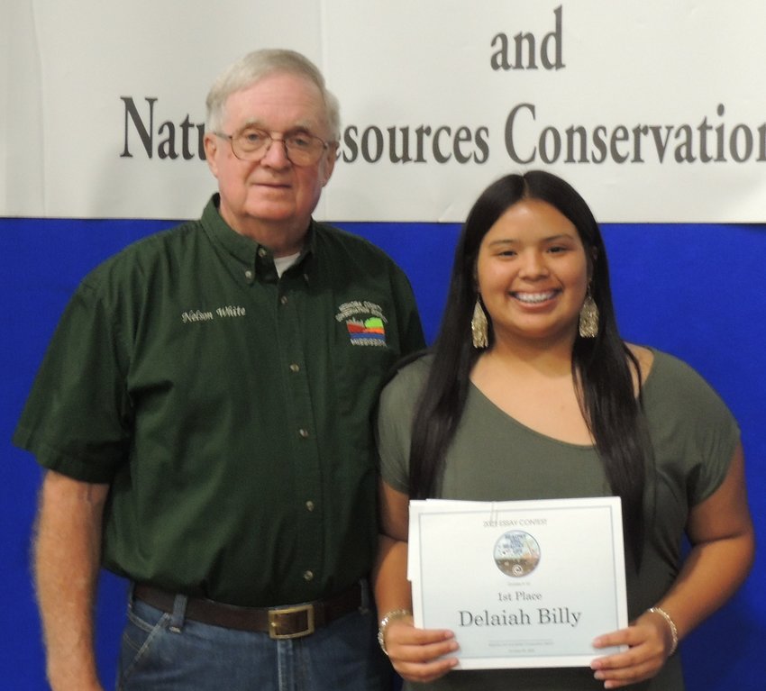 2022 eessay winner for grades 9-10 was Delaiah Billy. She is pictured with SWCD Chairman Nelson White.